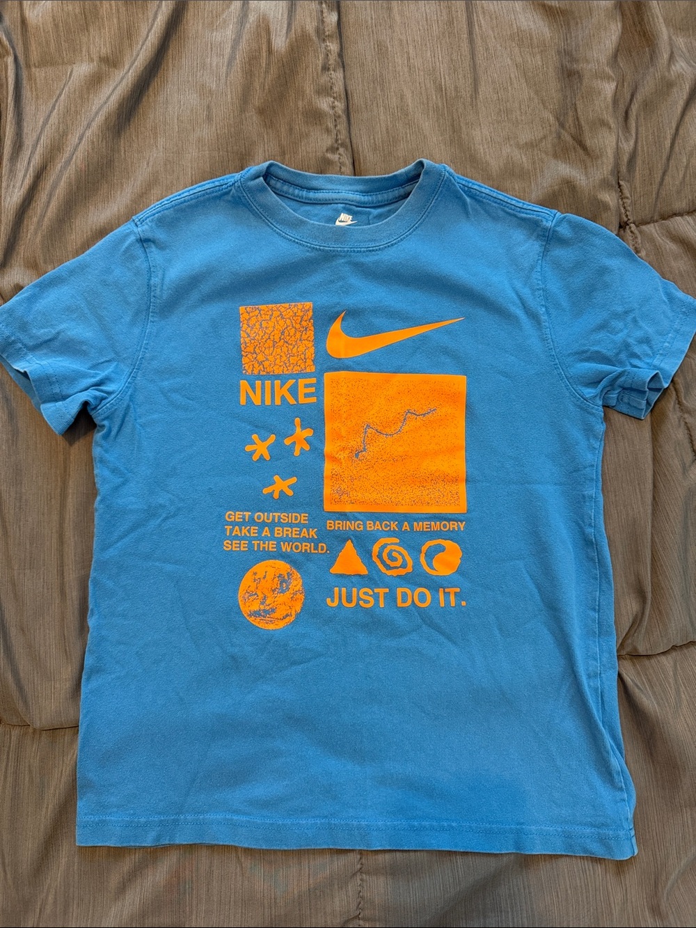 Nike Blue Tee with Orange Graphic Elements swoosh